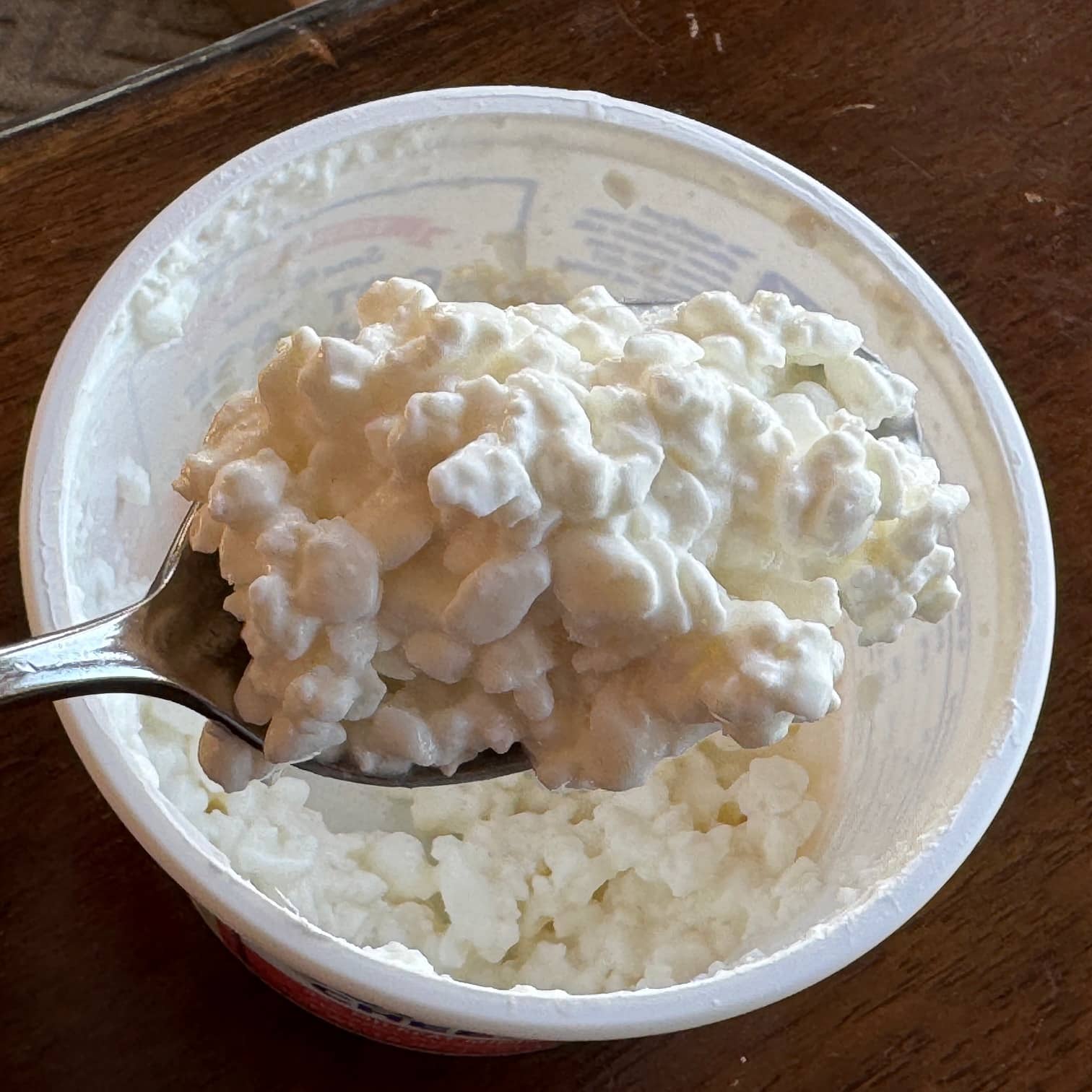 Trader Joe's' Small Curd Cottage Cheese on a spoon