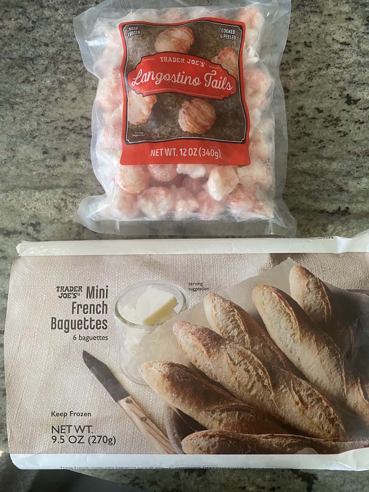 Packages of frozen langostinos and mini baguettes