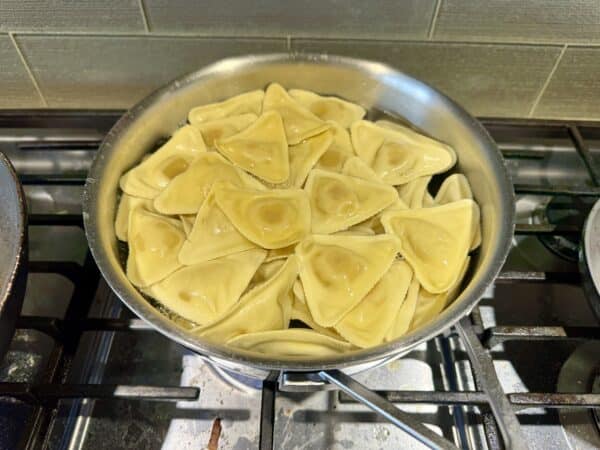 Cooking the ravioli in a pot of boiling water