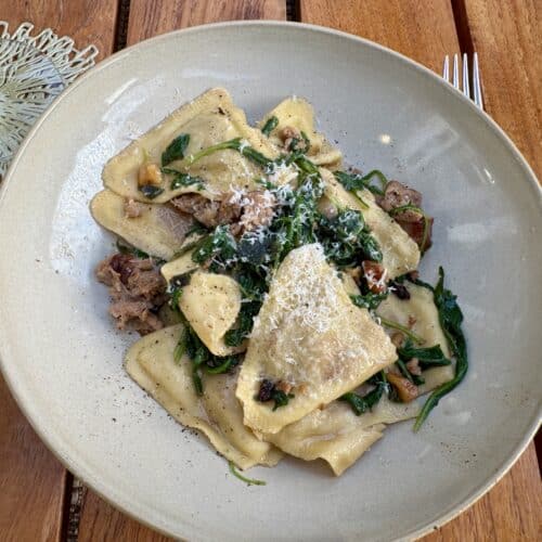 Trader Joe's Butternut Squash Ravioli with crispy sage, brown butter, sausage and arugula recipe in a dish
