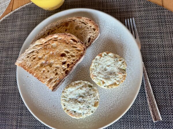 Trader Joe's Harvest Vegetable Hash Egg White Bites on a plate with some toast