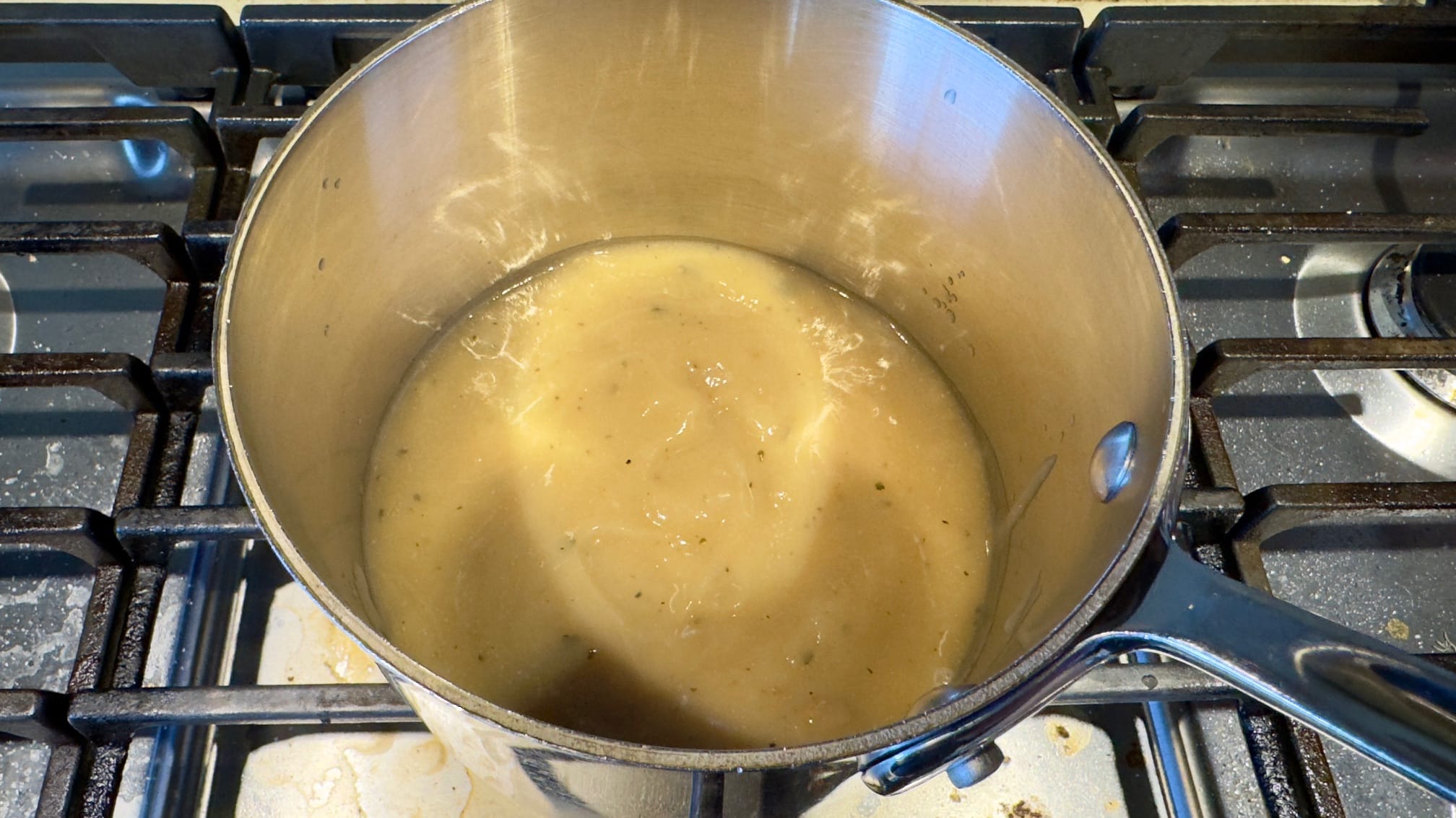 Trader Joe's Gluten Free Turkey Gravy heating in a pot