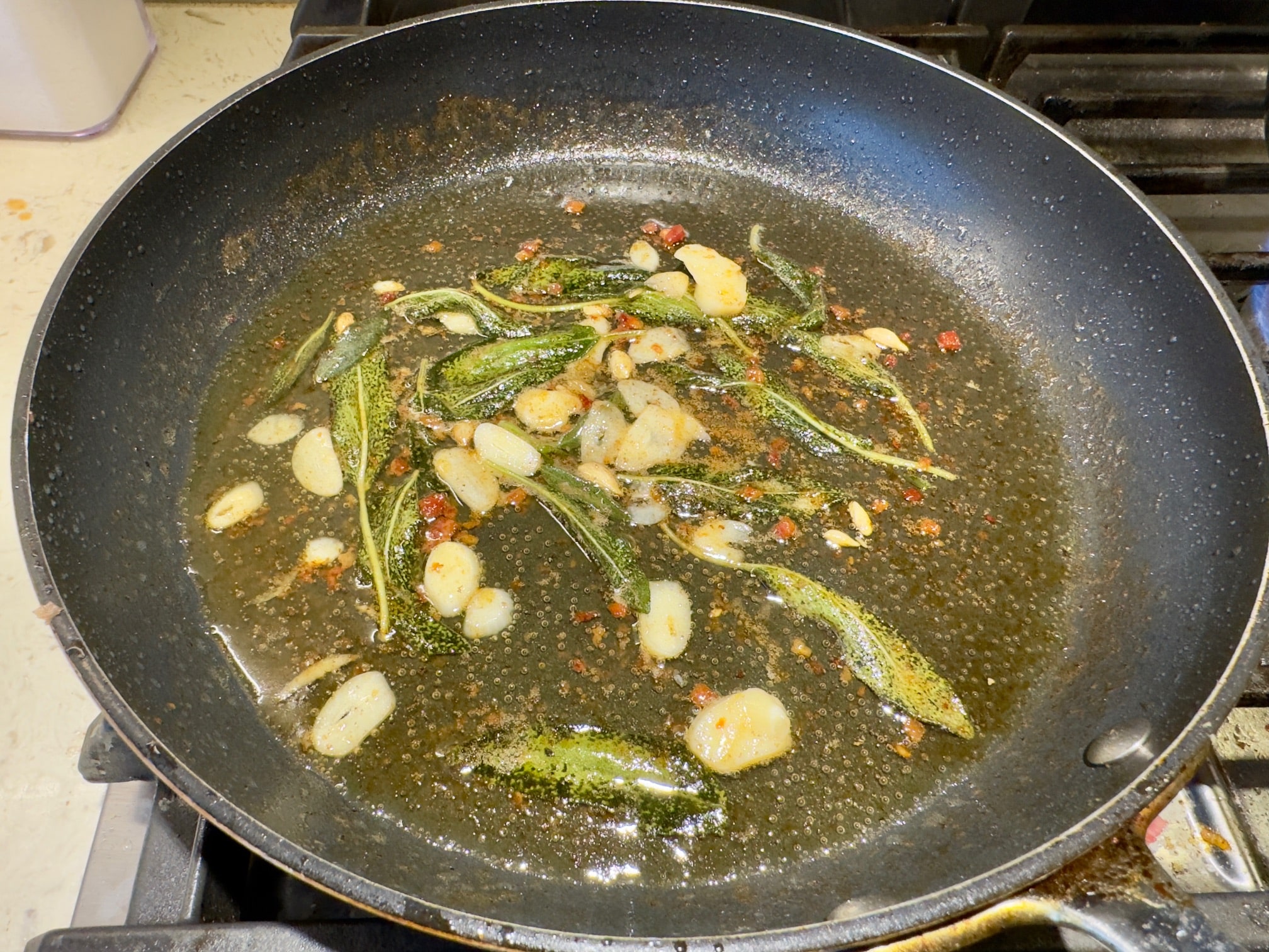 Cooking the brown butter, sage, lemon juice and garlic
