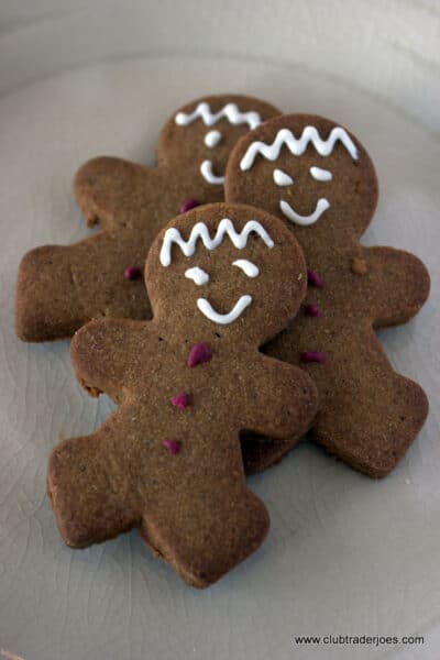 Three Trader Joe's Mini Gingerbread Men cookies with white icing faces