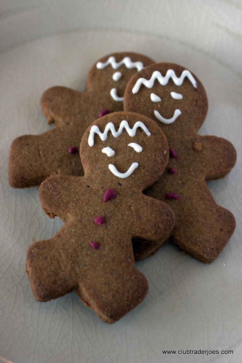 Three Trader Joe's Mini Gingerbread Men cookies with white icing faces