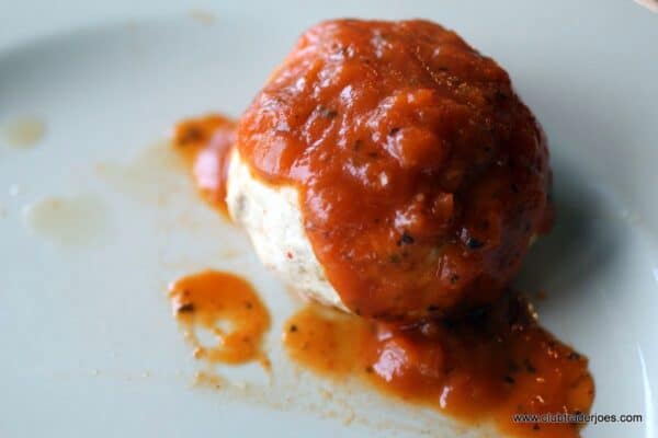 Trader Joe's Chicken-less Stuffed Cutlet topped with tomato sauce on a plate